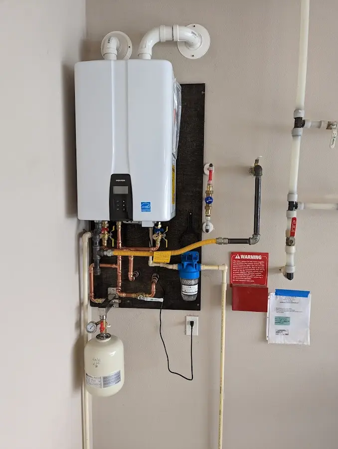 Professional plumber installing copper piping in a Herculaneum home
